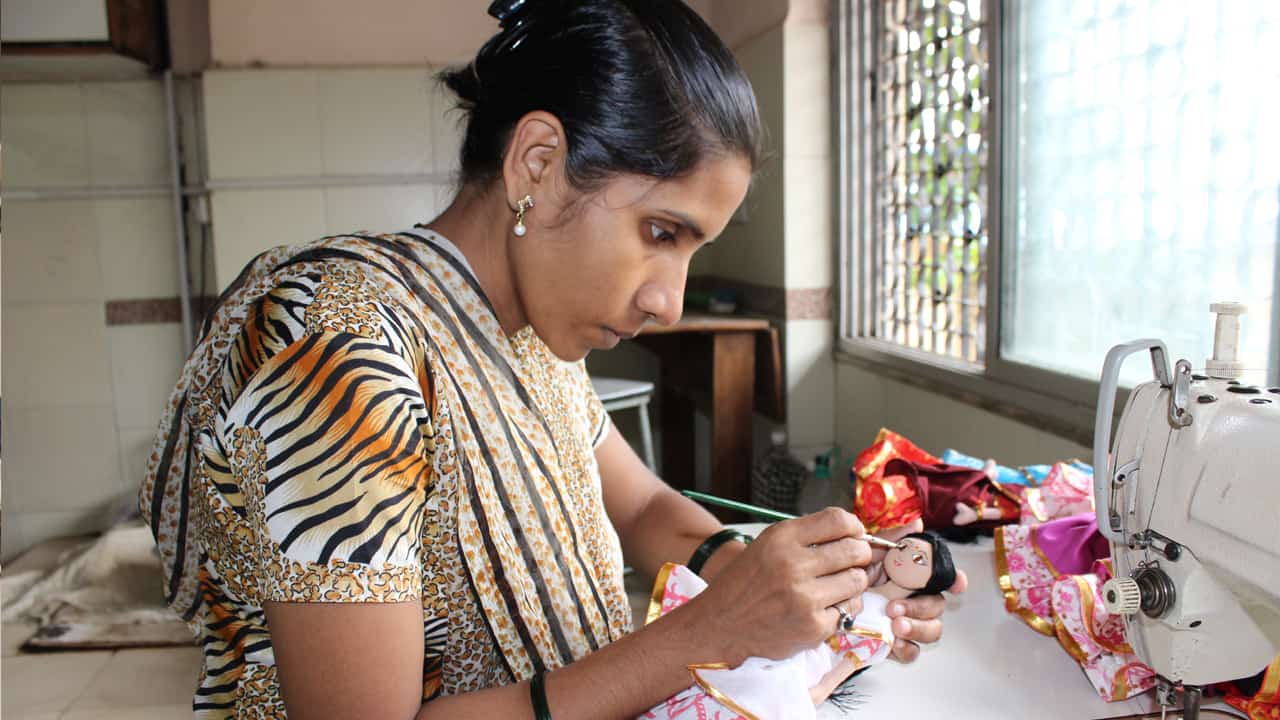 Woman making a doll - Creative Handicrafts Coop