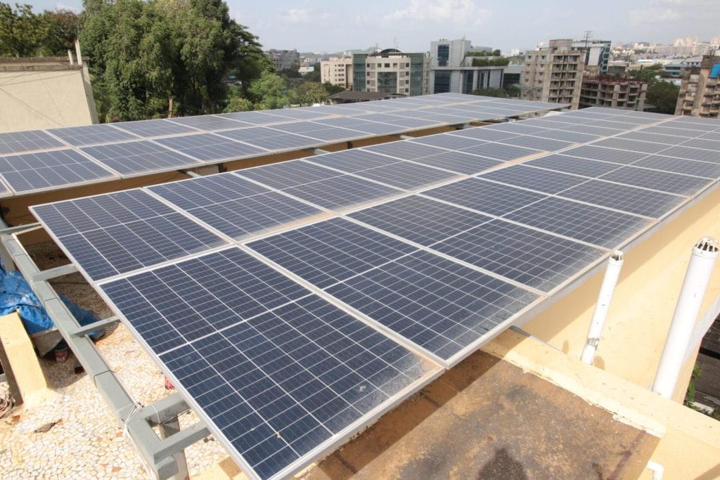 Solar panels on the roof of Creative Handicrafts' facility in Mumbai, India